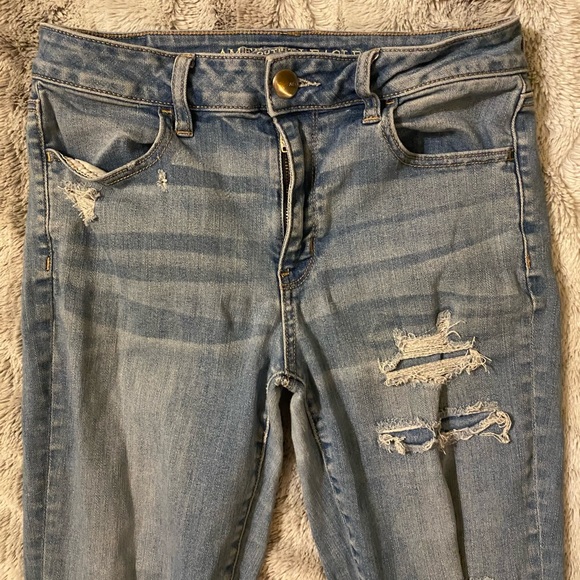 American Eagle | High Rise Super Stretch Skinny Distressed Light Blue Jeans - Picture 3 of 7
